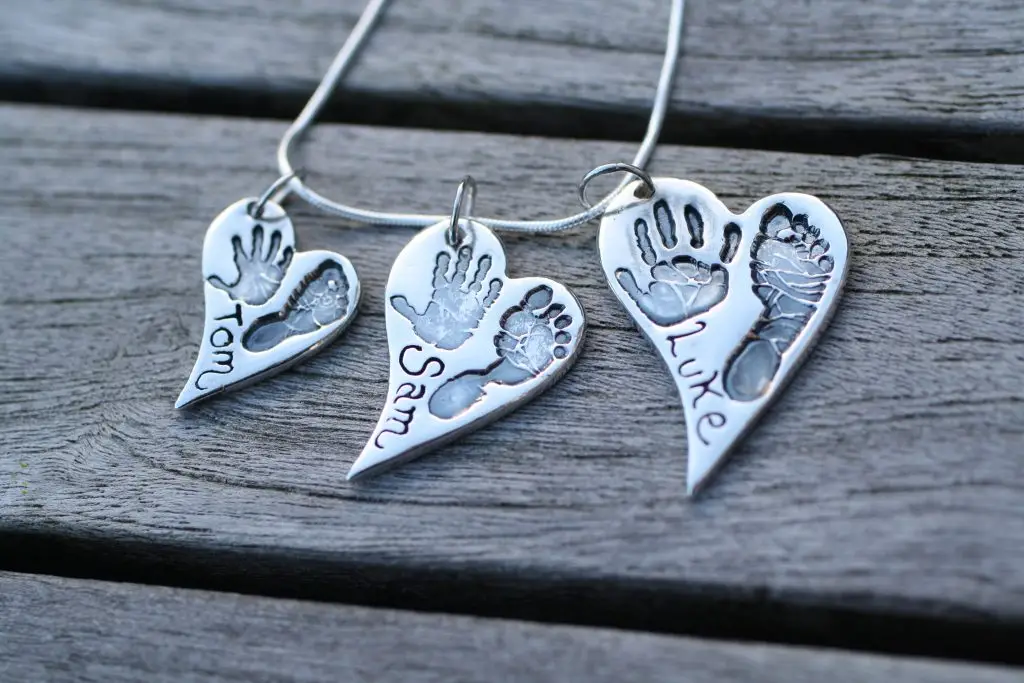 Silver handprint charm made by a student at Precious Memories keepsake training courses UK – learn silver jewellery and raised tiles
