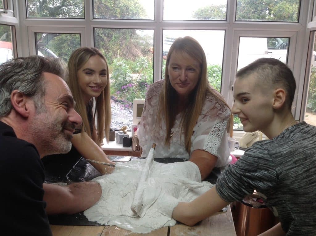 Family receiving their memorial 3D handcasting, capturing love, memory, and connection with award-winning keepsake artist